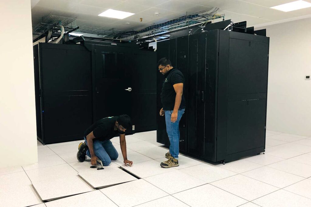 DCX Technologies Power Team performing data center Maintenace and data center power & cooling service